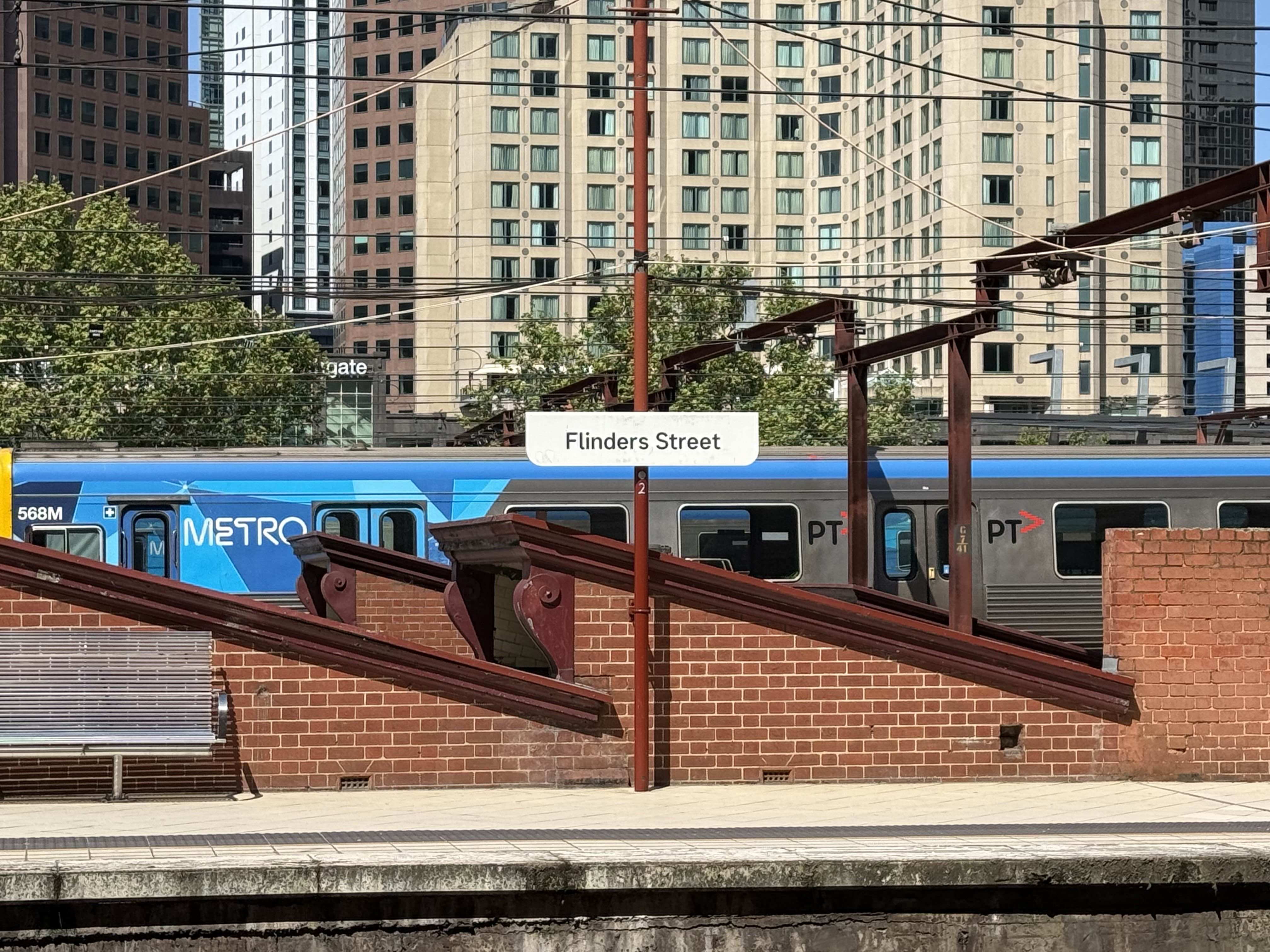 Picture of a sign on a platform at Flinders Street station that reads flinders street