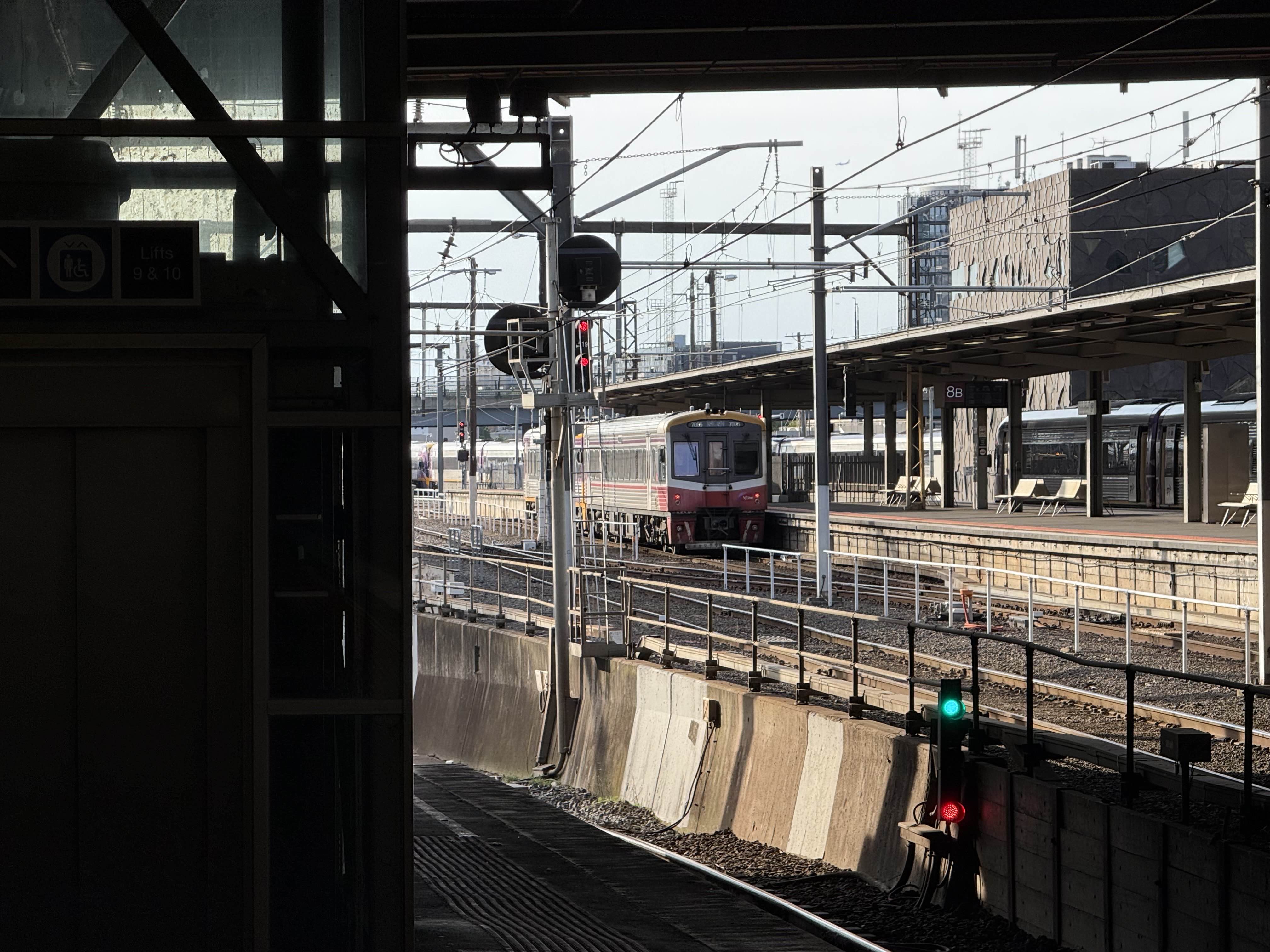 sprinter train waiting at a platform, it has the yellow/white/red livery